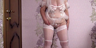 Mature bride with a fat ass, big tits at a home photo shoot. Chubby MILF in veil, sexy lingerie backstage. PAWG behind the scene