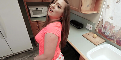 Amateur cockteases is talking dirty while stripping in the kitchen